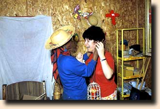 Anita Roddick tries on Mary's wig