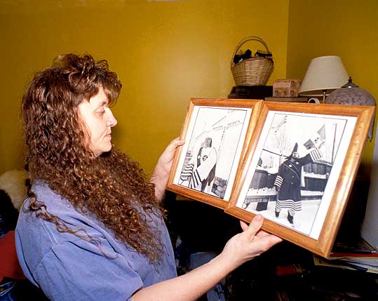 Pamela with photos of Jeffery