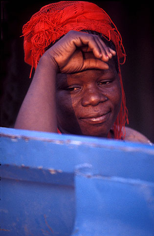 Woman behind blue door