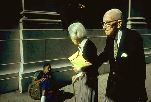 White couple and homeless man in New York