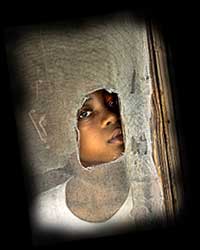 Black child in poverty - a victim of racism and social injustice. Click on all photos and reviews for enlargements and full text