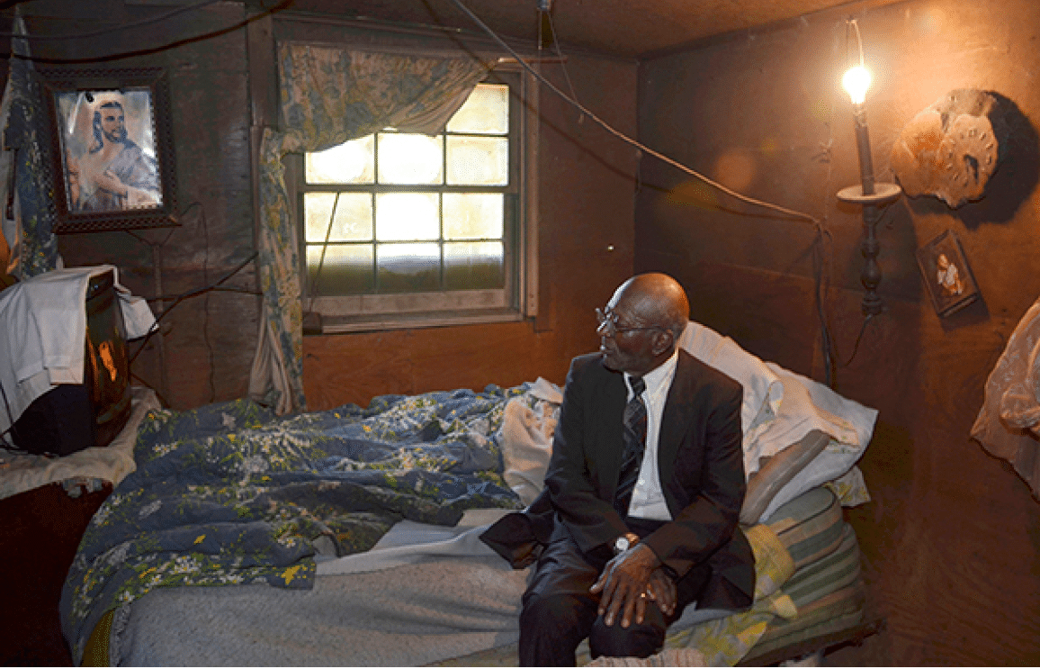 2012 - Preacher relaxing in his shack after church, Perry County, AL 