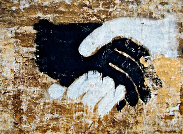 Painting of black white hands shaking hands
