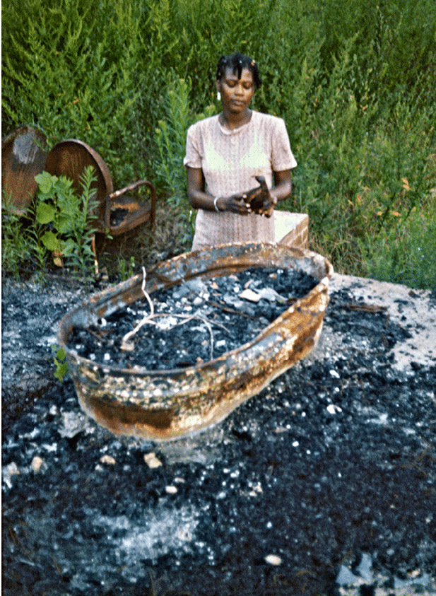 Mary at her house after the firebombing   
