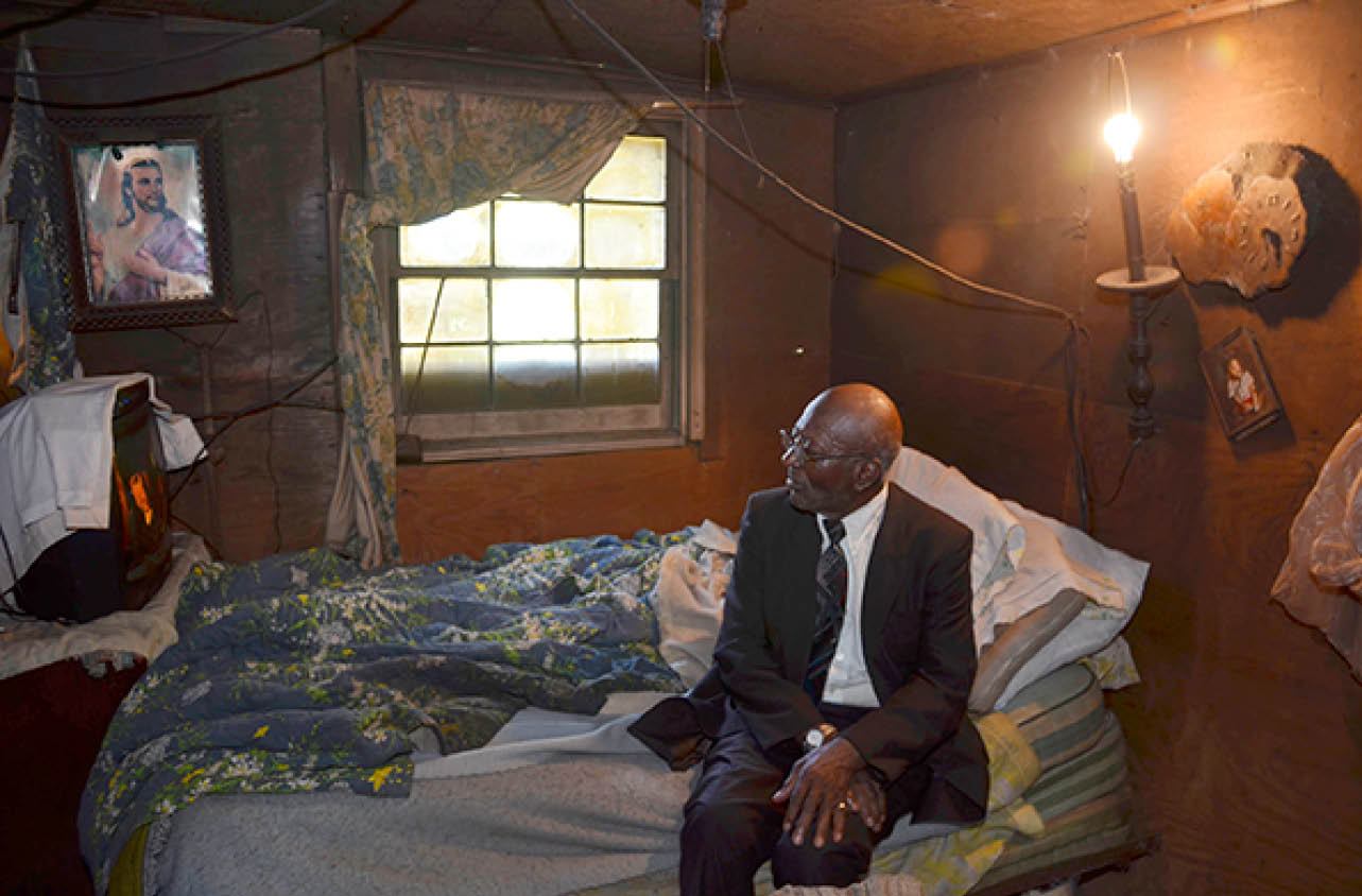 2012 - Preacher relaxing in his shack after church, Perry County, AL 