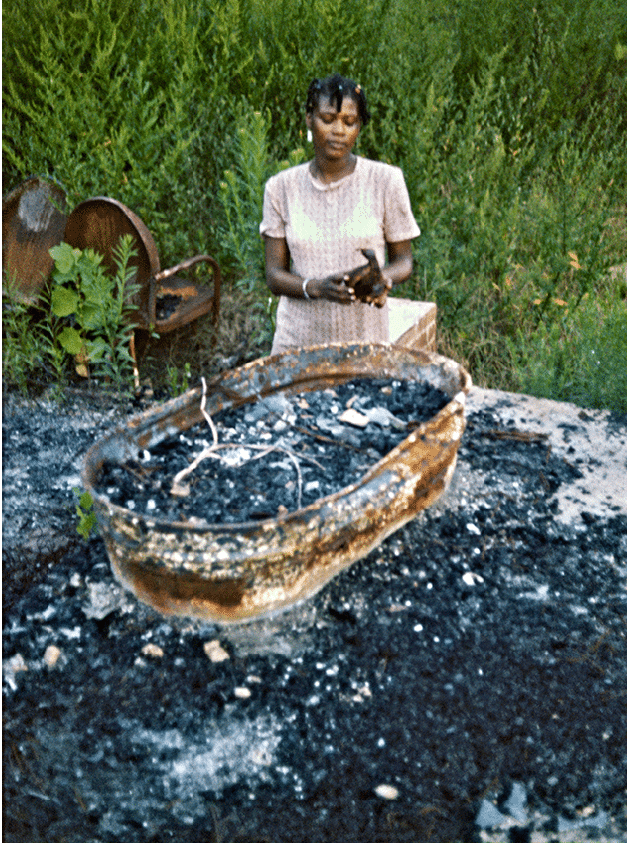 Mary at her house after the firebombing   