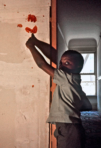 Boy showing where his family member was killed - 1975 SF