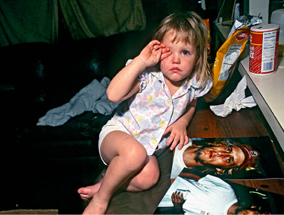 Angel at two with her uncle Woody who later raped her
