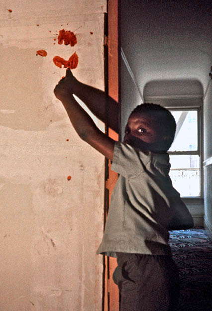 Boy showing where his family member was killed - 1975 SF