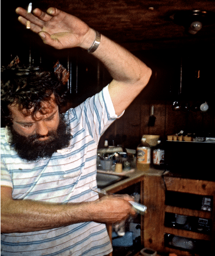 John demonstrating how he twisted the knife in the black man