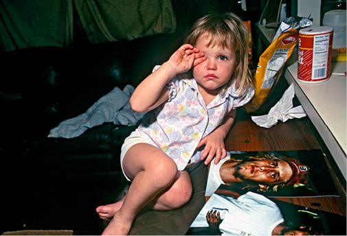 Angel at two with her uncle Woody who later raped her