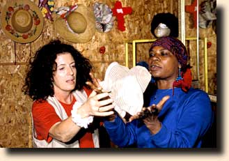 Anita Roddick and Mary changing hats